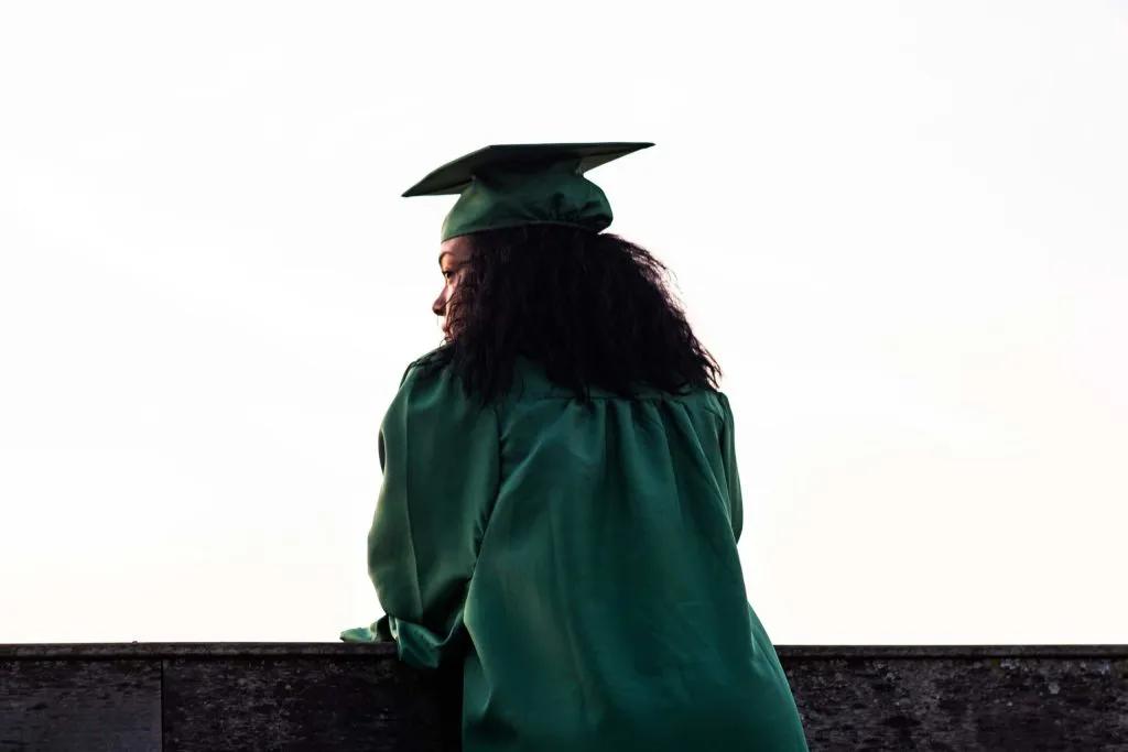 a graduate looking off into the distance