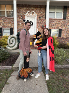 Nick White, his wife, and their two children dressed up for Halloween
